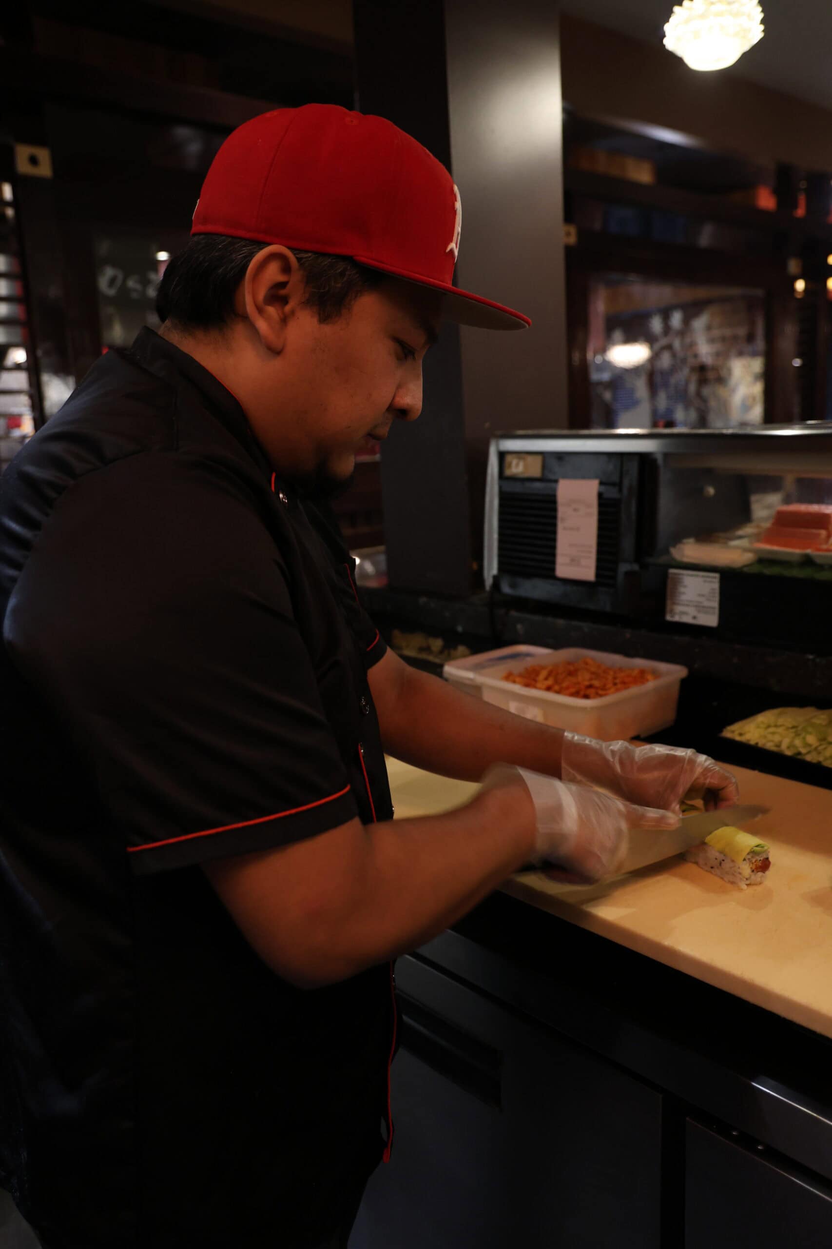 Chef preparing sushi at Osaka Japanese Cuisine restaurant in Osaka.